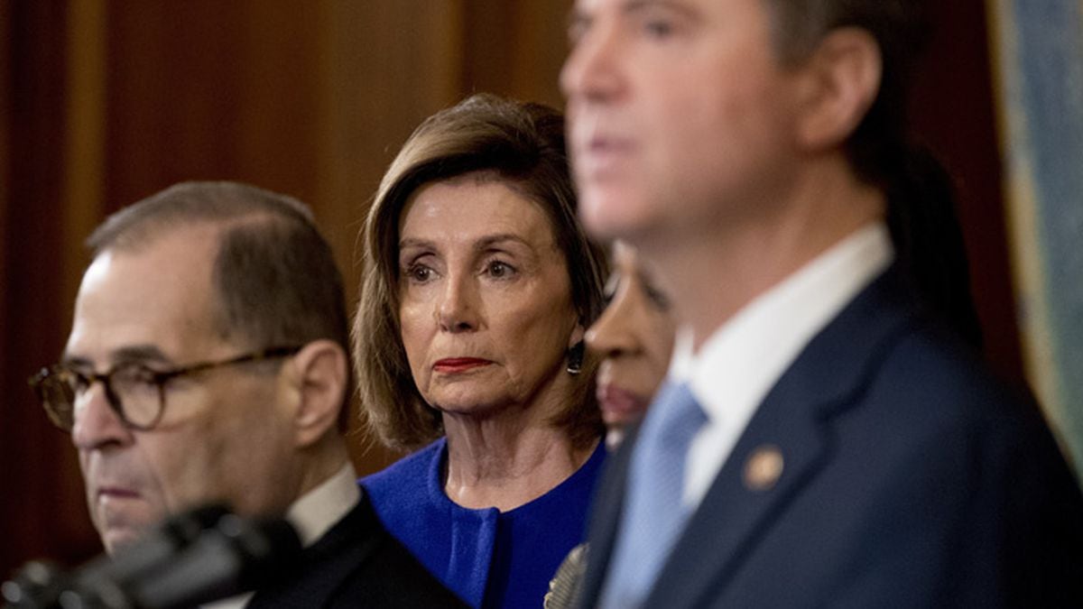 House Speaker Nancy Pelosi of Calif., center, and Chairman of the House Judiciary Committee Jerrold Nadler, D-N.Y., left, listen as Adam Schiff, D-Calif., Chairman of the House Intelligence Committee, foreground, speaks during a news conference to unveil articles of impeachment against President Donald Trump, abuse of power and obstruction of Congress, Tuesday, Dec. 10, 2019, on Capitol Hill in Washington. (AP Photo/Andrew Harnik)