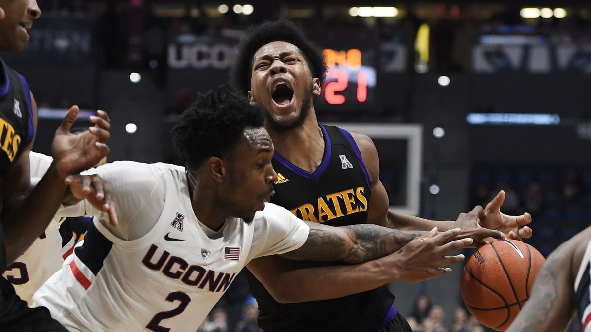 Connecticut's Tarin Smith (2) fouls East Carolina's Jayden Gardner (1) during the first half of an NCAA college basketball game, Sunday, Feb. 3, 2019, in Hartford, Conn. (AP Photo/Jessica Hill)