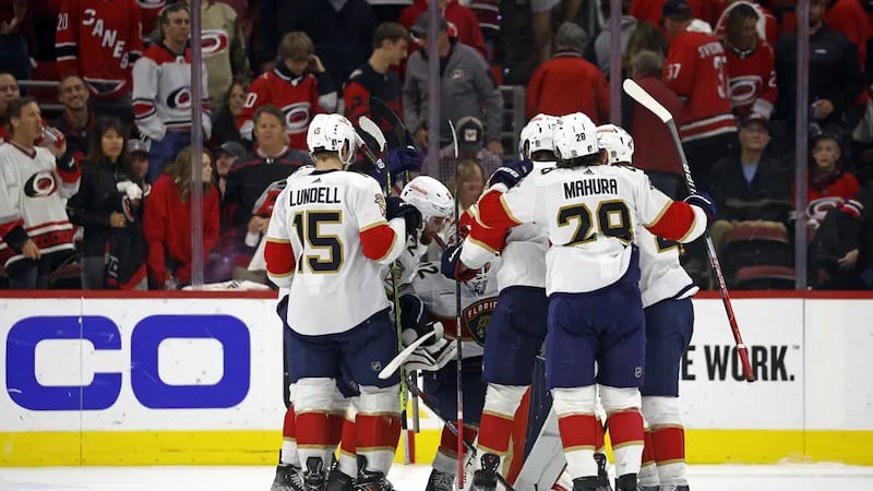 he Florida Panthers surround goaltender Sergei Bobrovsky following the team's win 3-2 win over...