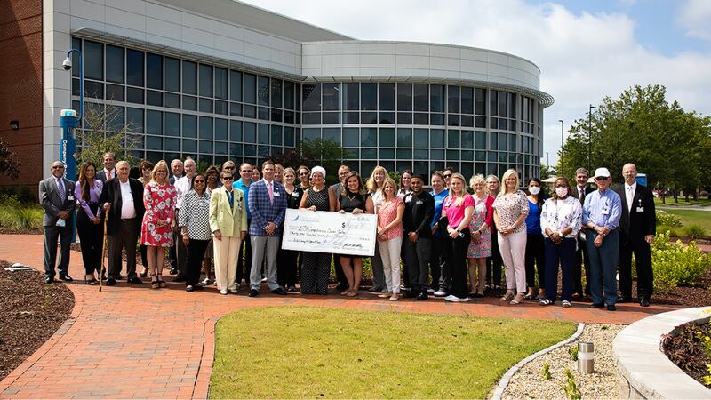 CarolinaEast Foundation, board members, leadership, and staff pose with Cancer Center patients...