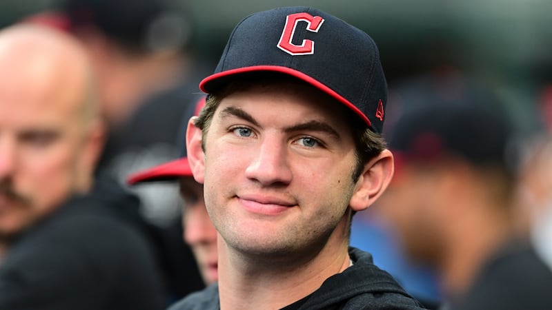 Cleveland Guardians starting pitcher Gavin Williams watches from the dugout during the fifth...