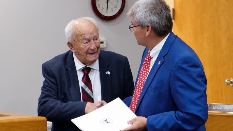 Commissioner Chris Chadwick (right) presents Mr. Houston Salter
(left) with a “Proclamation...