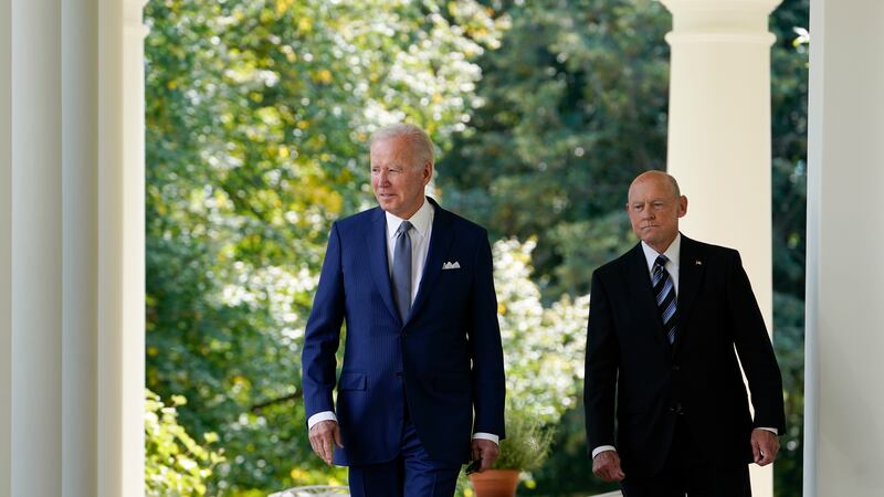 President Joe Biden walks with Bob Parant, Medicare beneficiary with Type 1 diabetes, as they...