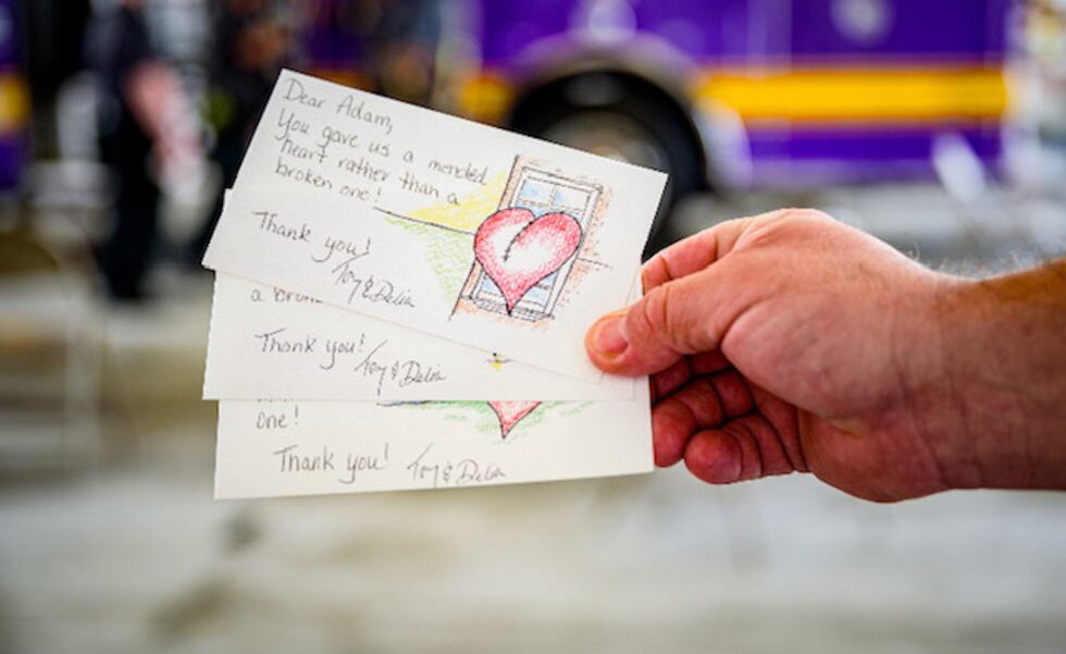 Tony and Delia Parker make cards for first responders who helped save Tony's life.