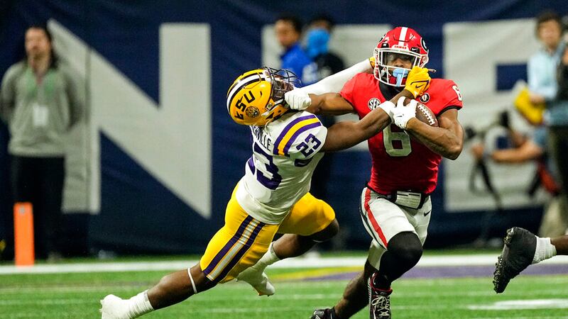 LSU linebacker Micah Baskerville (23) drags Georgia running back Kenny McIntosh (6) down in...