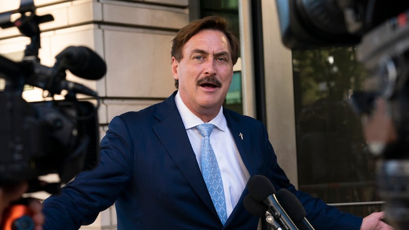 FILE - MyPillow chief executive Mike Lindell speaks to reporters outside federal court in...