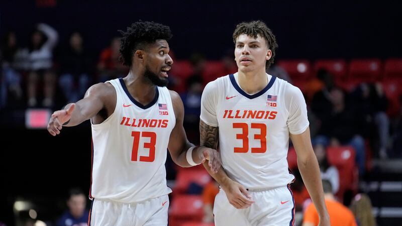 Illinois forward Quincy Guerrier (13) talks to forward Coleman Hawkins during an NCAA college...