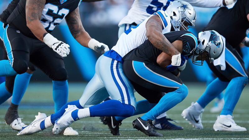 Carolina Panthers quarterback Bryce Young (9) is sacked by Dallas Cowboys defensive end Sam...