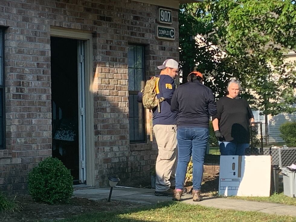 FBI agents serve court authorized search warrant in Greenville.