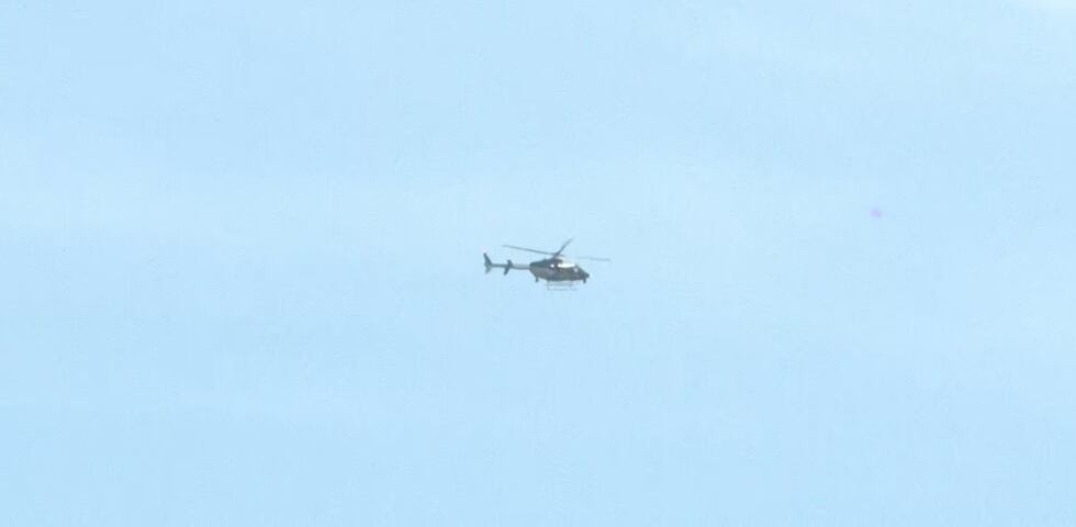 Helicopter hovering over scene where three deputies were shot in Wayne County